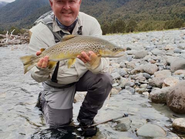 Craig Henderson, Australia with a South Island New Zealand brown trout, guided by Reefton fly fishing guide, Bryan Wilson