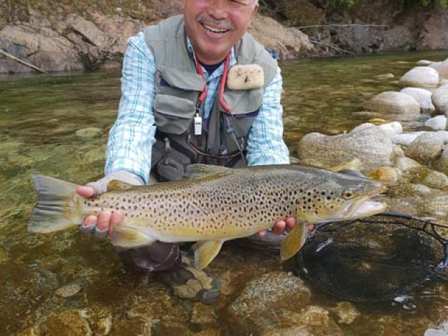 Sachio Nakagoshi, Japan, with a fine West Coast brown trout, guided by Bryan Wilson, Reefton fishing guide.