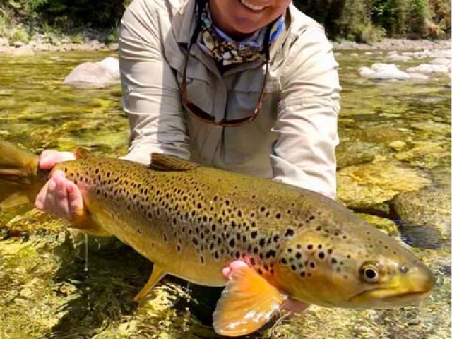 Whitney McDowell USA with a South Island New Zealand brown trout, guided by Reefton fly fishing guide, Bryan Wilson