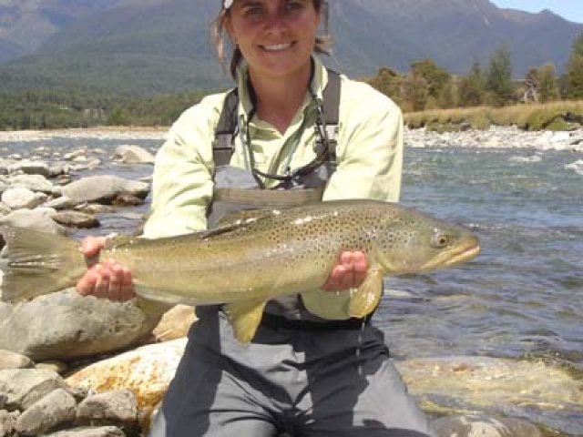 Whitney McDowell USA with a South Island New Zealand brown trout, guided by Reefton fly fishing guide, Bryan Wilson